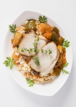 Gluten-free roasted pork with vegetables over rice